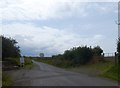 Minor road passing the entrance to Eastaway Manor