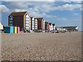 Beach huts and apartment blocks on Seaford Esplanade