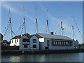 ST5772 : Masts and flags in the dock by Neil Owen