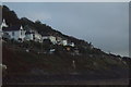 View of houses on The Parade at Mousehole from the coastal path at sunrise #2