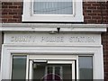 Inscription above doorway of former County Police station on Halkyn Street, Holywell