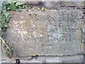 Inscribed stone in wall on Halkyn Street, Holywell