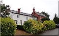 Houses set back from the B4216 at Greenway