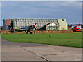 TL4646 : Spitfire PV202 and Fire Tender outside the Classic Wings Hangar at Duxford Airfield by David Dixon