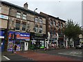 Old brick facades and modern plastic signs, Wilmslow Road