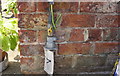 Benchmark on outbuilding at Brompton Banks