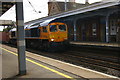 Container train passing Stowmarket station at speed