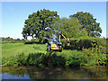 SJ9825 : Hedge cutting by the Trent and Mersey Canal near Weston by Roger  D Kidd