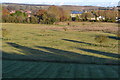 Long shadows across field towards Wick