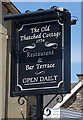 Sign for the Old Thatched Cottage restaurant, Weston-Super-Mare