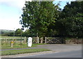 Footpath and milepost on Lane Head Road (A635), Clough Green