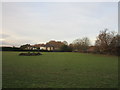 Grass field and houses on Mansfield Road