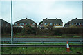 Semi detached houses beyond the A52