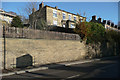 Retaining wall with blocked-up well, Elland Road, Brighouse