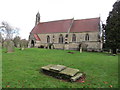 The church of St Leonard with part of its burial ground at Burton Leonard