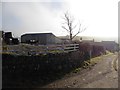 Shilstone Farm emerges from a winter mist