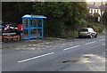 Queen Elizabeth II postbox between a bus shelter and a bench, Church Road, Seven Sisters