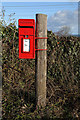 A pole-mounted post box at Bilsdean