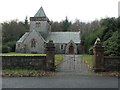 NX9257 : Churchyard gates, Southwick parish church by Christine Johnstone