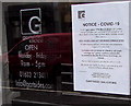 Covid-19 notice in the window of Gartsides solicitors, 2 Corn Street, Newport