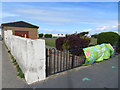 Electricity sub-station and a bench mark, Meols Parade, Hoylake