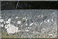 Benchmark on eastern parapet of bridge on Casthorpe Road