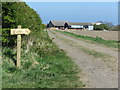 NZ3375 : Public Footpath Sign, Hartley West Farm, Holywell by Geoff Holland