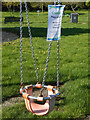 Closed swing - Cawston Grange Play Area