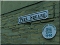 SE2635 : Plaque on a wall, Peel Square by Stephen Craven