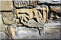 Weathered benchmark on wall at junction of Mill Lane and High Street