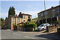 Houses on Commonside (house numbers around 100) and bus stop