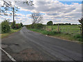 Minor road passing Tweedieside near Sandford