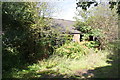 Overgrown outbuilding at No. 1580 Melton Road,