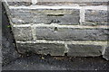 Benchmark on wall at entrance to #246 Bradford Road