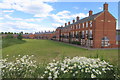 Terrace of town houses lining the playing fields