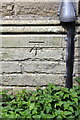 Benchmark on furniture store at Home View Terrace / Heaton Road junction