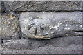 Benchmark on pier of railway bridge in middle of A646