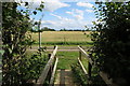 Footbridge and footpath out on to Folly Farm Lane