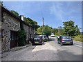 Houses and traffic on the B3193, the Teign Valley road, looking north