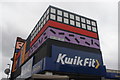 View of Camille Walala street art above Kwik Fit