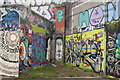 View of a wall of street art on the towpath of the Hertford Union Canal #3