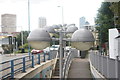 View of a row of spherical street lights at the entrance to the subway on the Blackwall Tunnel Approach