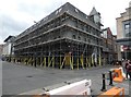 Corner Boy under scaffolding