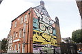 View of a D*Face mural on the side of Theatro Technis on Crowndale Road