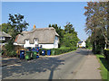 Shepreth High Street: plaster, thatch and bins