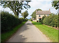SE3178 : Minor road near Sutton Grange by Ian S
