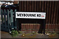 SP0795 : Road sign styles 7 Weybourne by Martin Richard Phelan