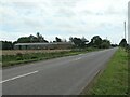 TF3228 : Common Road [B1357] passing Yew Tree Farm by Christine Johnstone