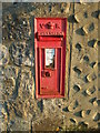 An old letterbox on a farm wall