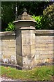 Benchmark on wall pier near entrance to Eshton Hall